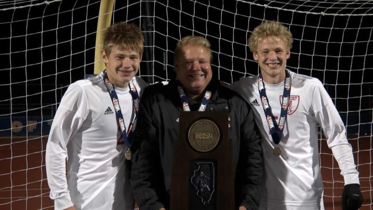 Troy, Carter and Chase Adams holding state trophy