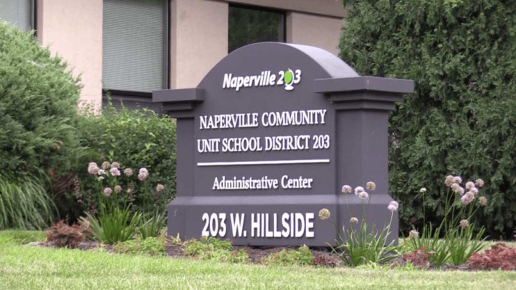 Picture of District 203 building and the sign