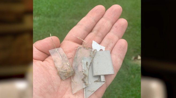 Fragments of metal, glass, etc sitting nicely on someones hand