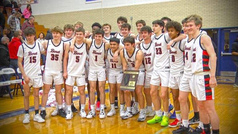 Benet posing with regional plaque