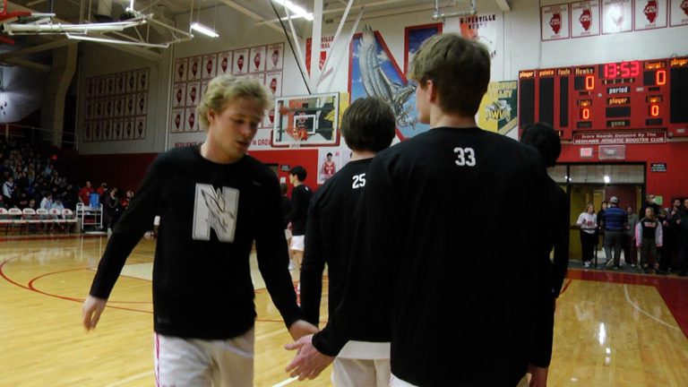 Naperville Central Redhawks ready to take the court against the Huskies.