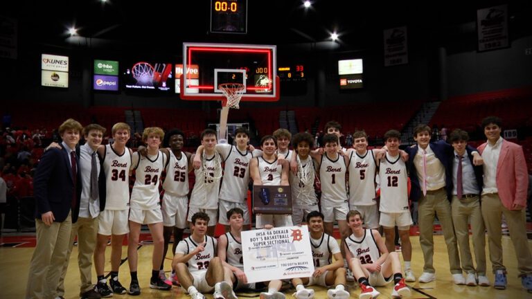 Benet Academy holding plaque and bracket