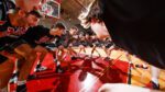 North Central men's basketball players huddle before a game