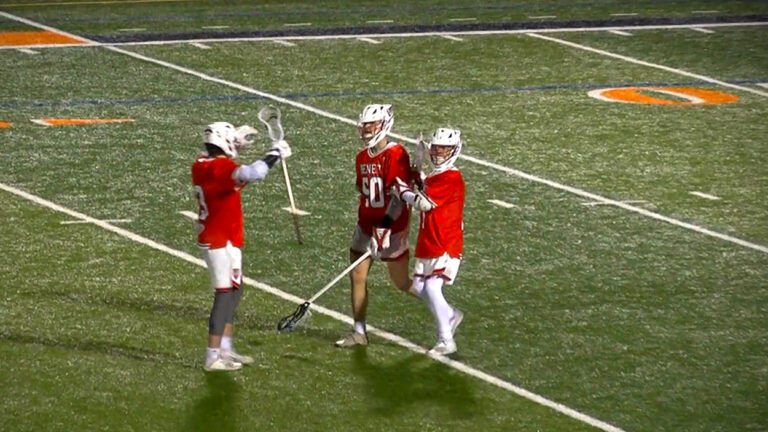 Thomas Tierney getting hugged by his teammates