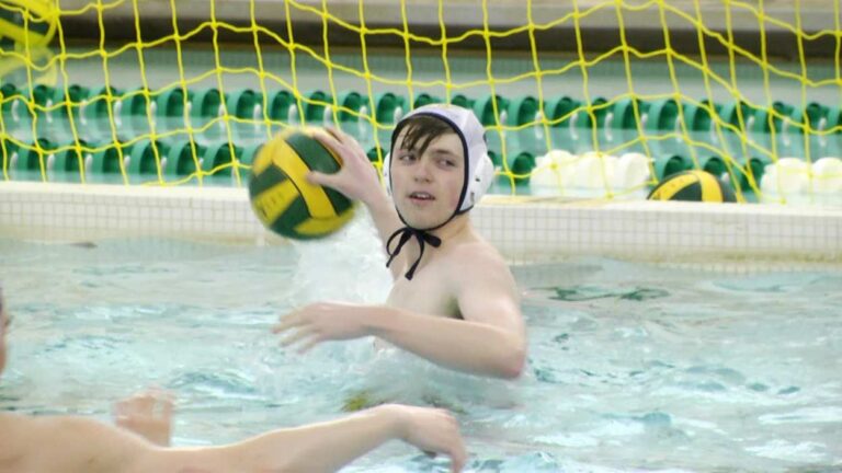 Austin Olson throwing a polo ball