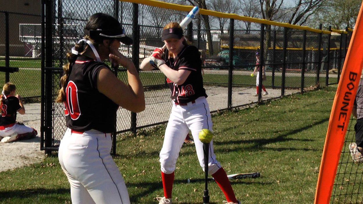 Strong hitting helps Academy softball fly by Naperville Central