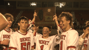 Benet Academy holding super-sectional plaque