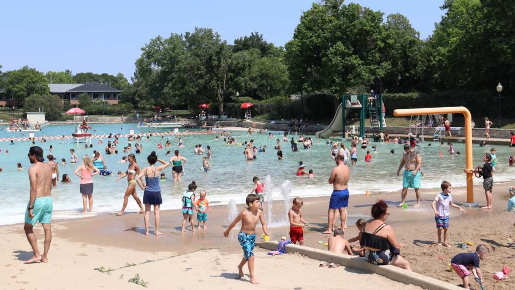 Naperville Park District water fun at Centennial Beach - people enjoying water and sand fun