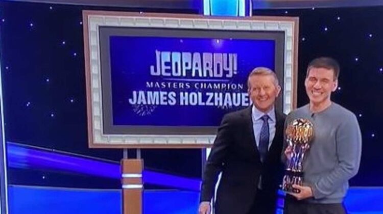 Naperville native James Holzhauer holding the Jeopardy! Masters Champion trophy.