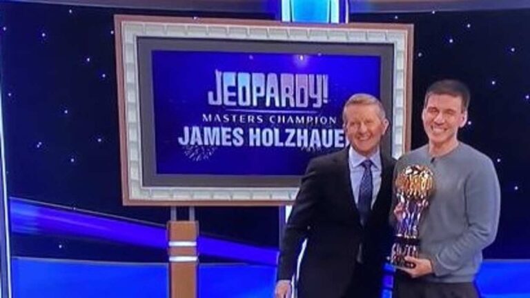 Naperville native James Holzhauer holding the Jeopardy! Masters Champion trophy.