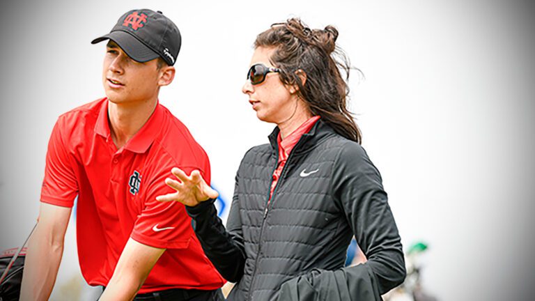 North Central head golf coach Alyssa Guss speaks with sophomore Cole Martin