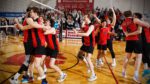 North Central men's volleyball celebrate their victory over Carthage College in the CCIW Men's Volleyball Tournament championship match