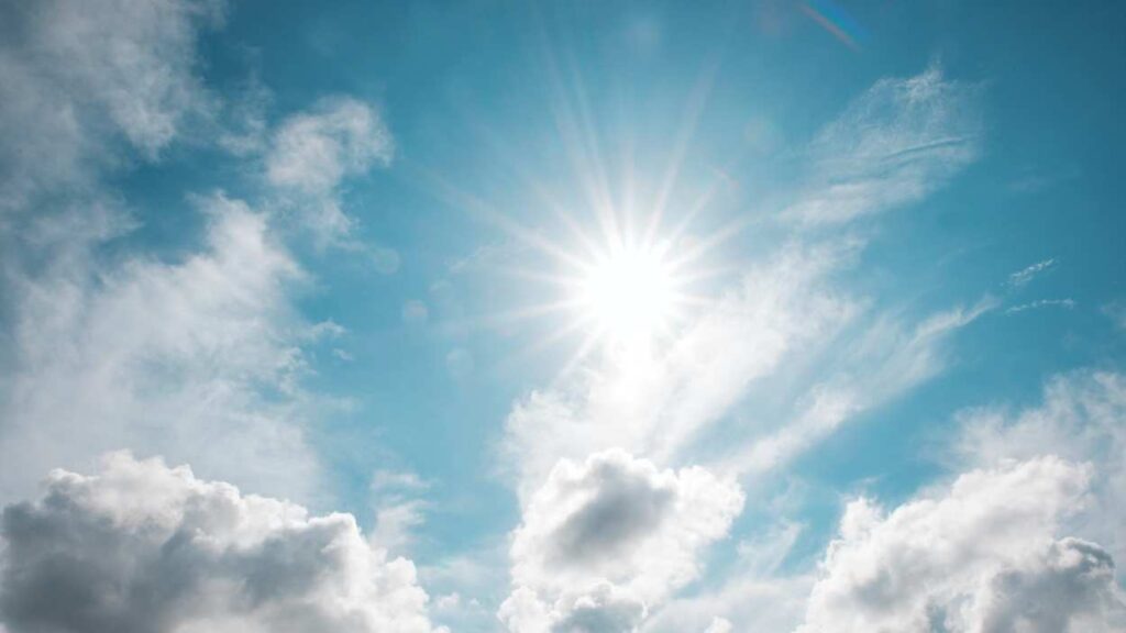 file image of sun shining through clouds