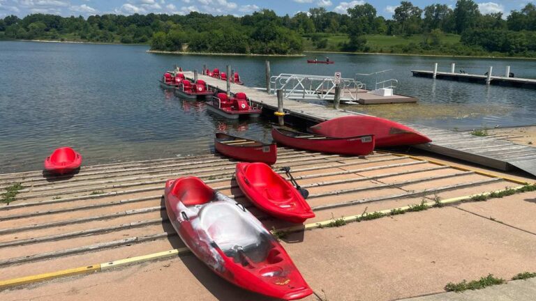Kayaks laying in front of the water at Silver Lake at the Blackwell Forest Preserve.