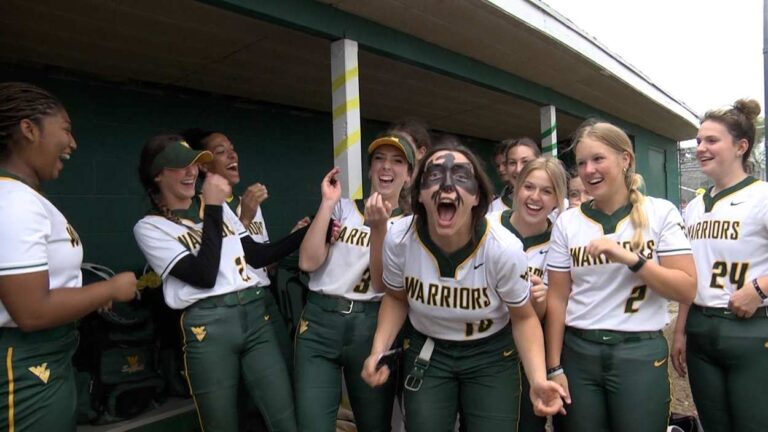 Waubonsie Valley softball shares a laugh in the dugout for Interview Antics