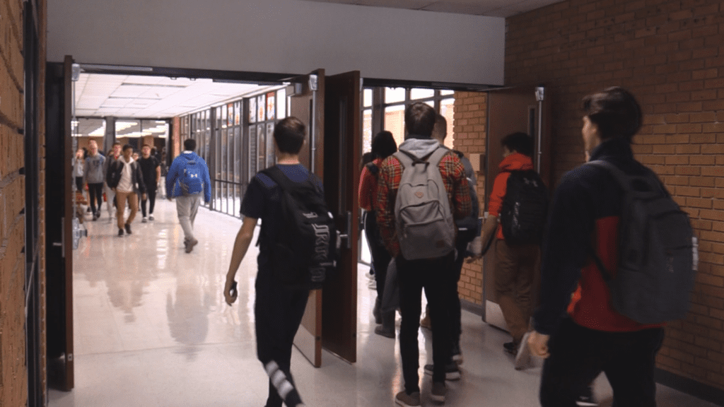 Students walking through hallway at District 203 school