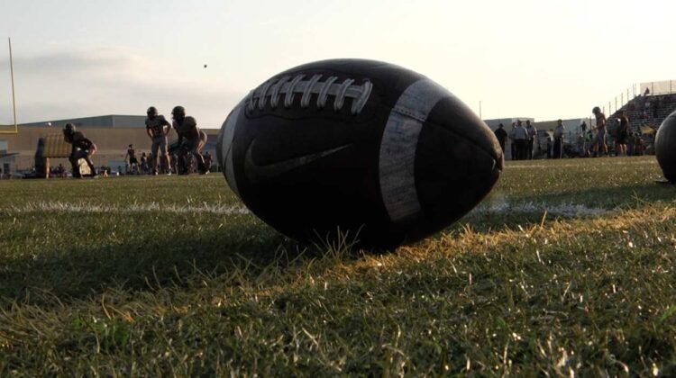 A football out on the field as DuPage Valley schools merge with the Southwest Suburban Conference