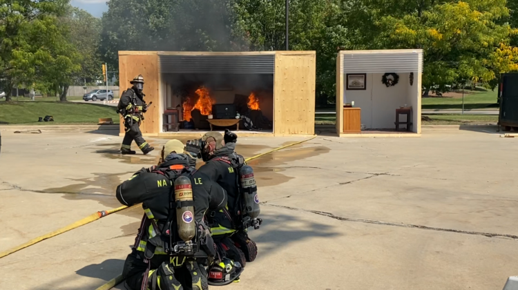 Naperville firefighters demonstrating how they put out fires.