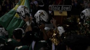 Waubonsie Valley celebrates with the Eola Bowl football trophy in week five of Football Friday