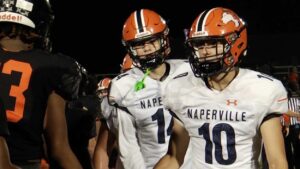 Naperville North's Carson Marlar and Austin Campbell in the post game handshake line.