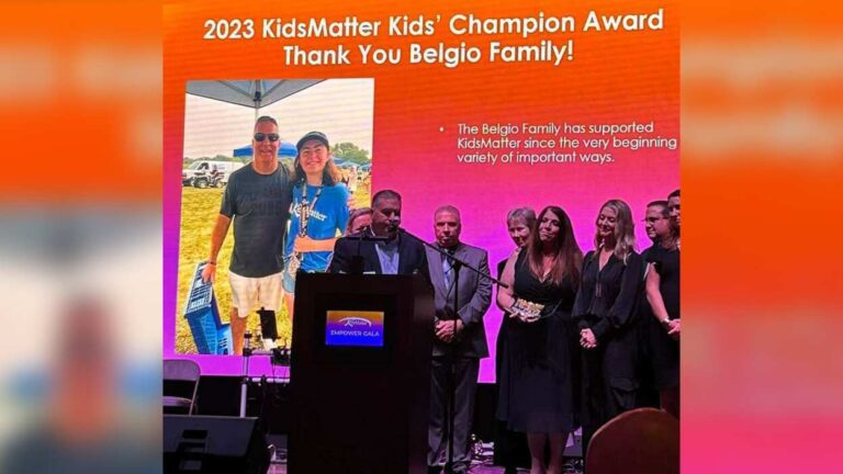 Belgio family on stage at KidsMatter Empower Gala receiving an award