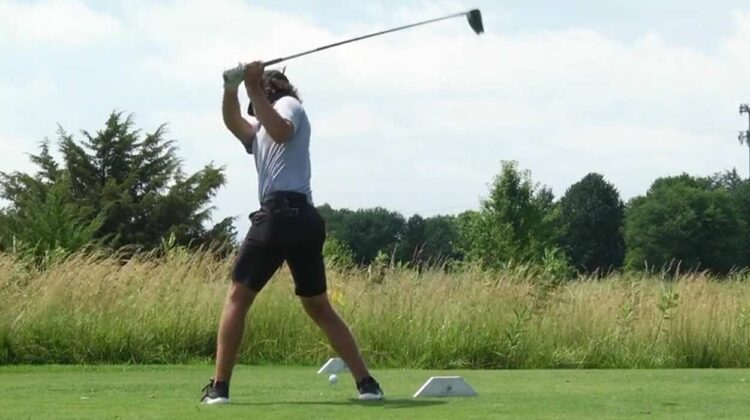 Golfer on Naperville Park District's Naperbrook Golf Course, swinging club