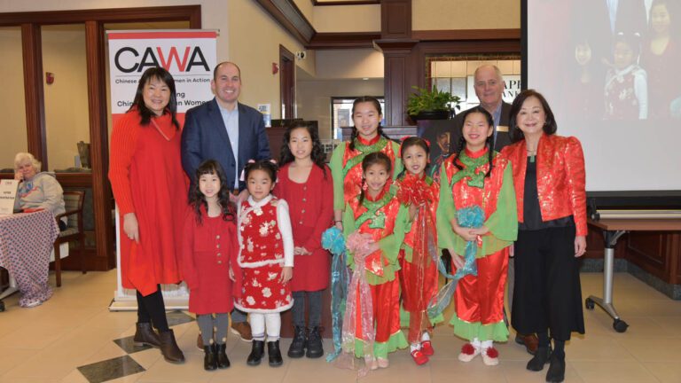 A youth group in traditional dress joins CAWA members and community leaders