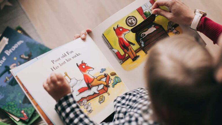 overhead shot of child reading book