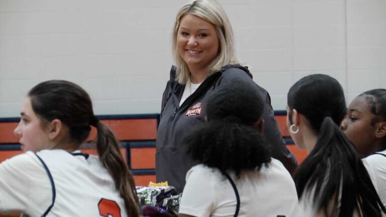 Naperville's Stefene Skowronski talks to her Naperville North players during a game.