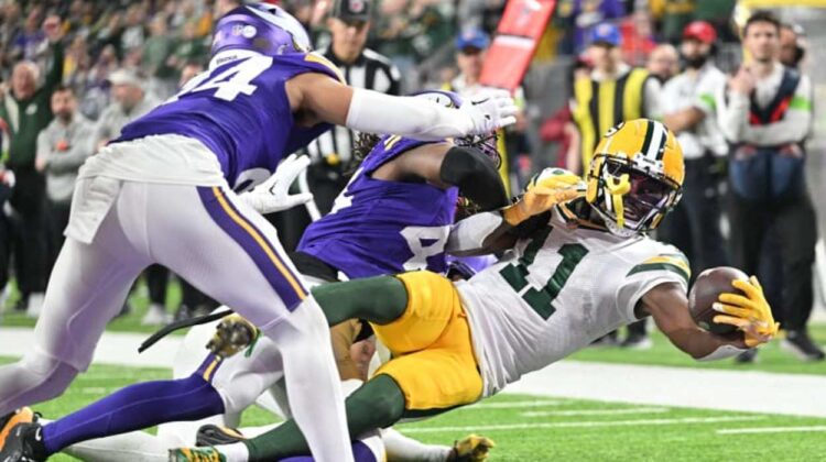 Jayden Reed scores a touchdown as part of a record breaking performance with the Green Bay Packers