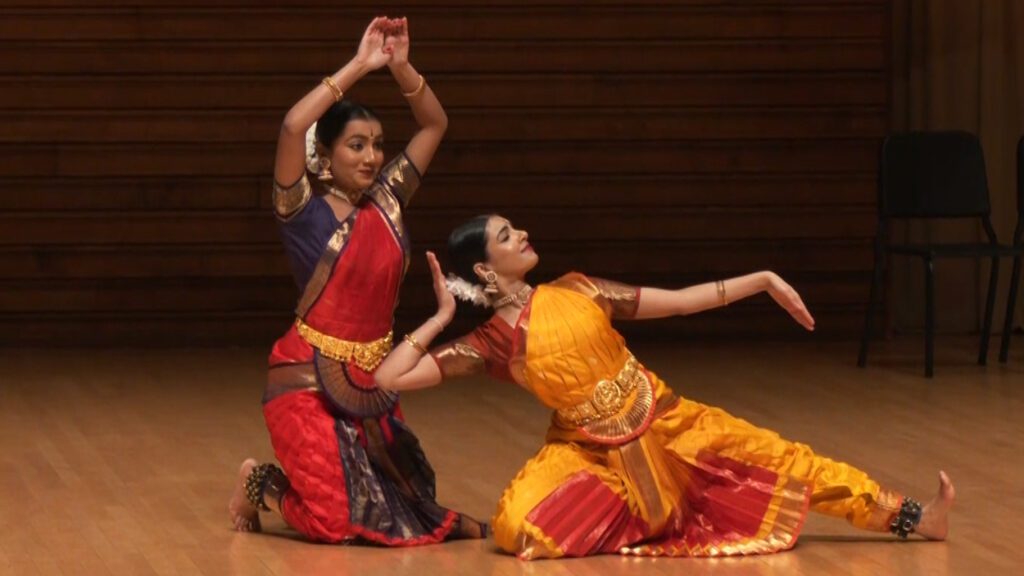Two women of Hindu background perform traditional dance at World Peace Day 2024 Service