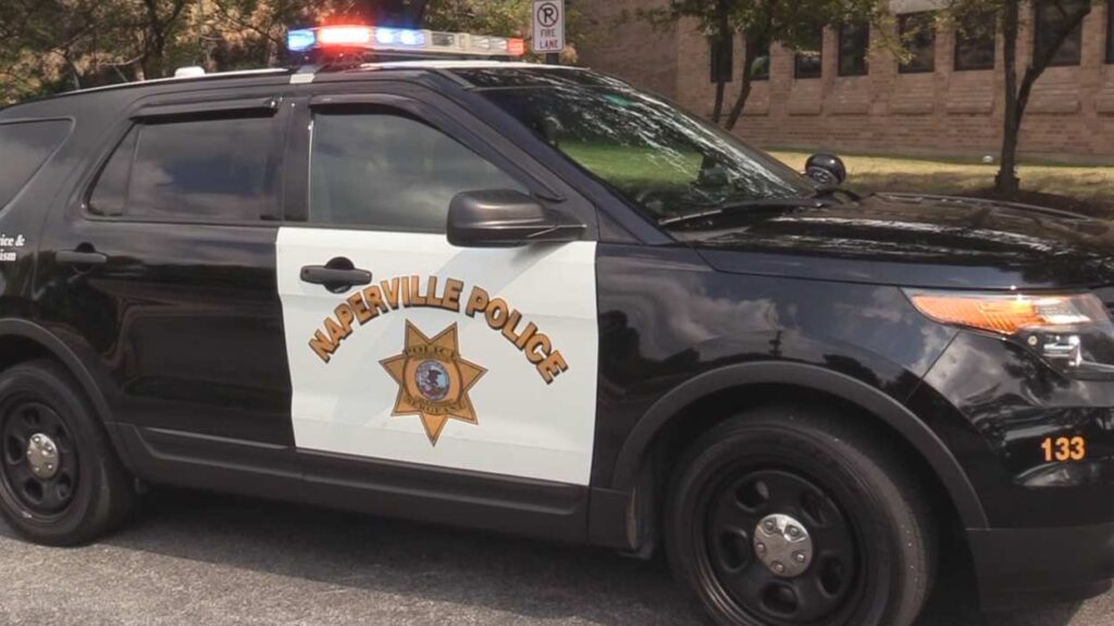 Naperville police car, side view, with lights on