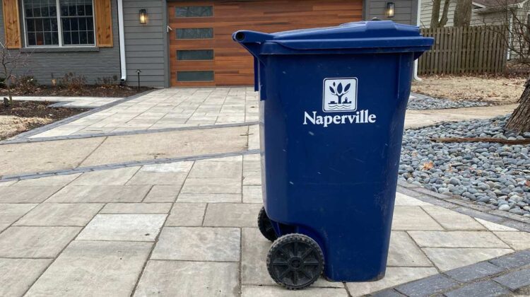 City of Naperville recycling bin sitting in driveway of home