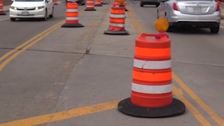 orange and white construction barrel on Washington Street in Naperville