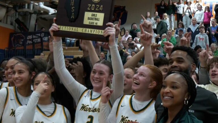 Lily Newton and her Waubonsie teammates celebrate after winning the Sectional Championship.