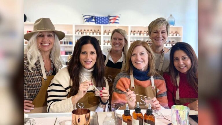 Gals creating candles at Sea Love