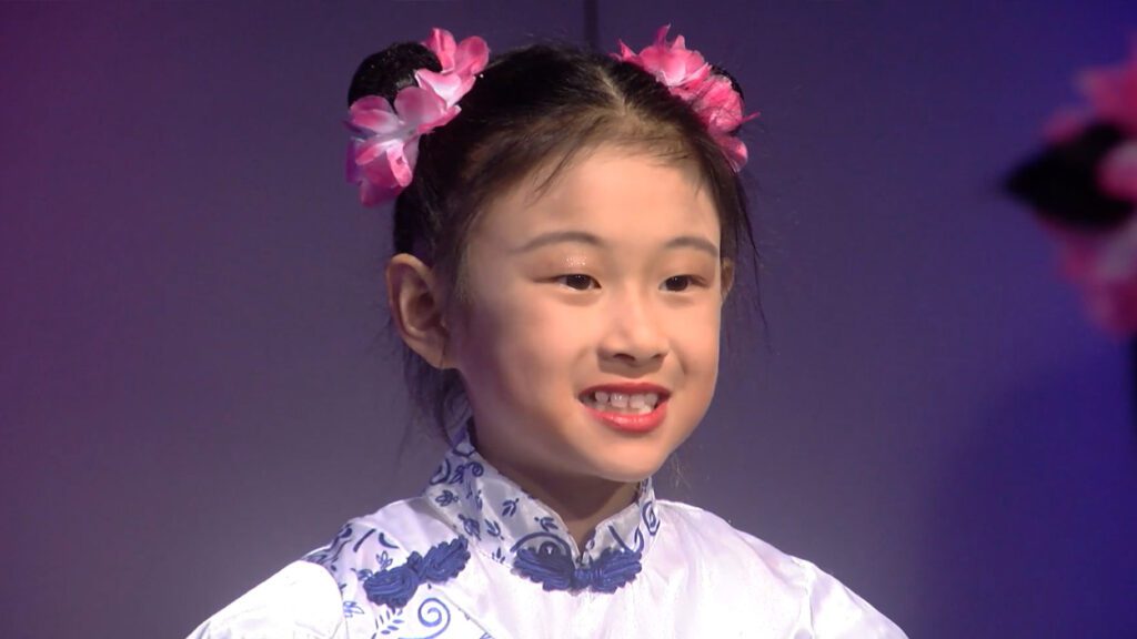 Xilin childrens choir performer smiles in the NTV17 studio