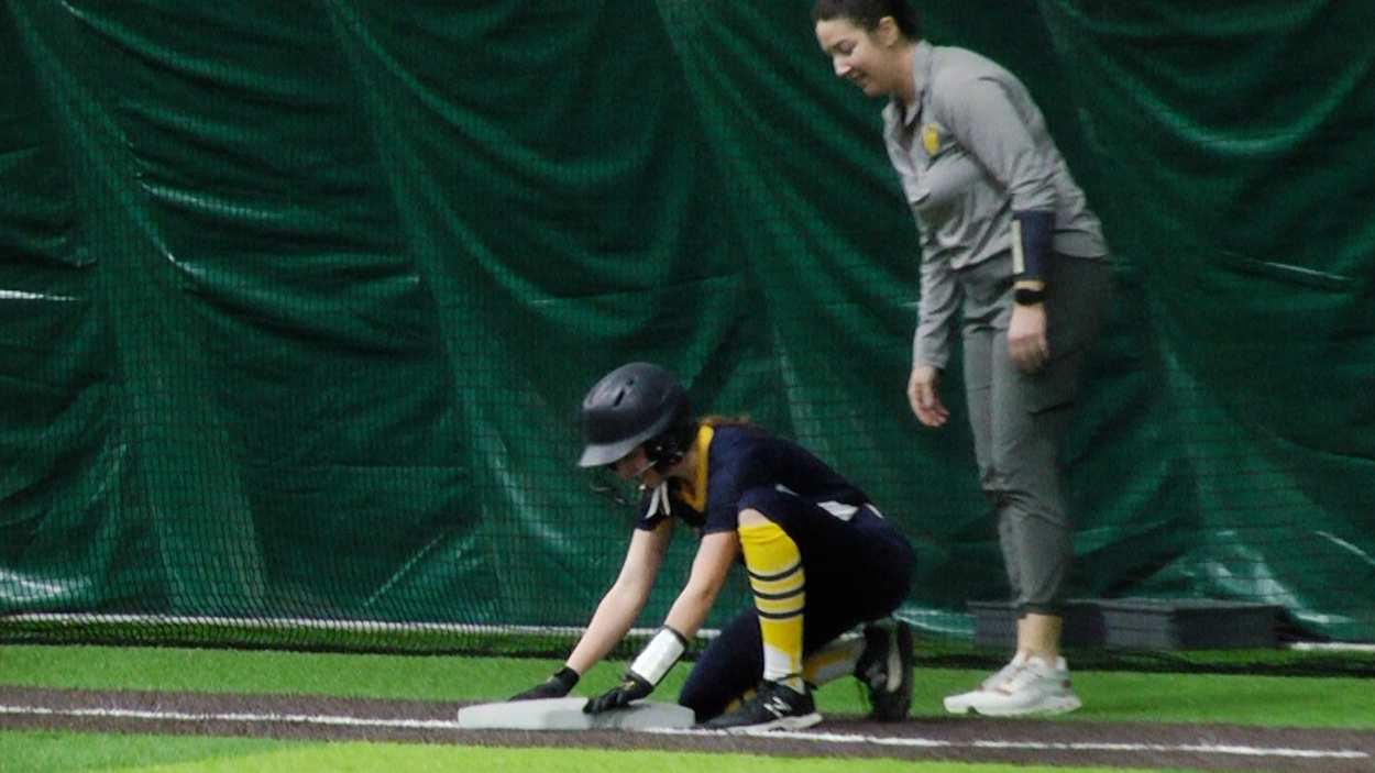 Freshman Tegan Spellerberg hits an RBI triple to tie the game for