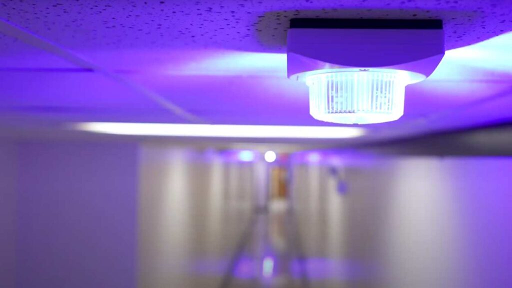 Security alert strobe light on ceiling in school hallway