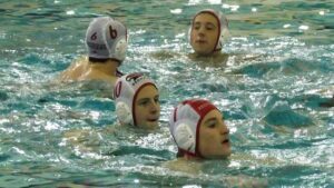 Naperville Central boys water polo players warm up before Neuqua Valley game.