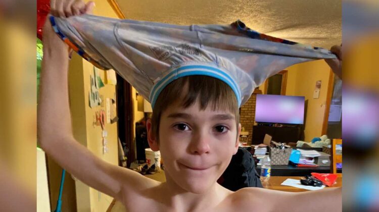 Kid with underpants on head
