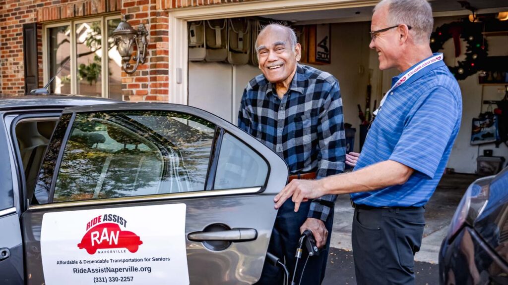 Ride Assist Naperville volunteer driver and senior citizen get ready to drive to an appointment