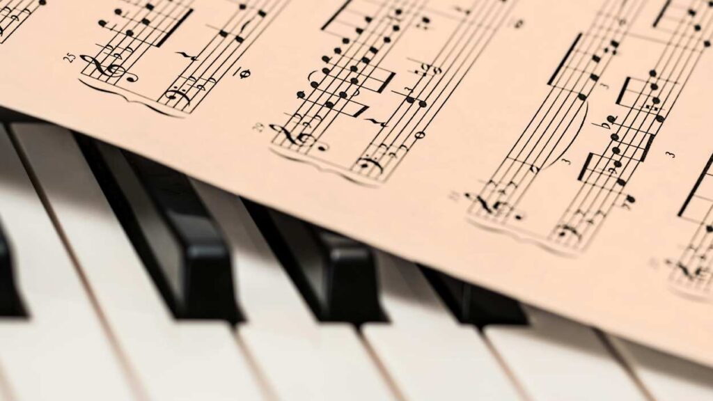sheet music and piano keys