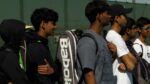 Metea Valley boys tennis players await their matchup against Waubonsie Valley