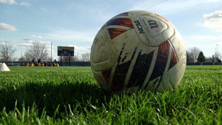 A soccer ball on the grass before the Naperville Central and Neuqua Valley girls soccer game