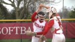 Naperville Central softball players dance before their game against Naperville North