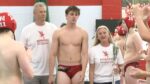 Naperville Central water polo player walks out for Senior Night.