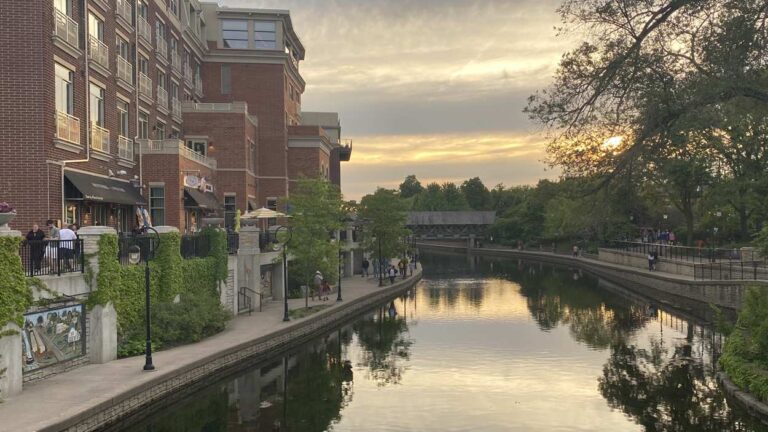 Sunset over Water Street shops and DuPage River in Naperville