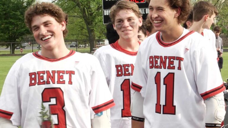 Benet Academy boys lacrosse seniors smile during Senior Night ceremony.