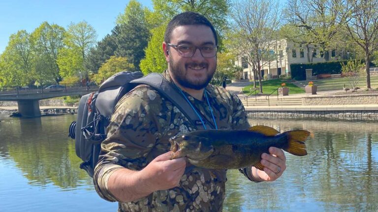 Nick Cicaulo catches a fish on the DuPage River